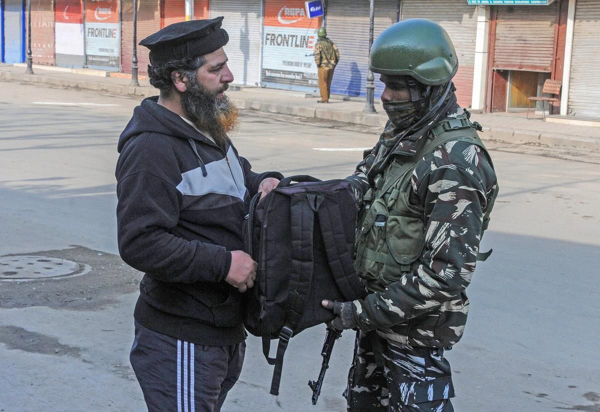 Security personnel checks the bag of a pedestrian during Prime Minister Narendra Modi's event at Sher-e-Kashmir International Conference Centre (SKICC), in Srinagar, Sunday, Feb. 03, 2019. According to the officials, the Special Protection Group (SPG) have been deployed at SKICC where PM Modi will inaugurate two projects. ( PTI Photo)