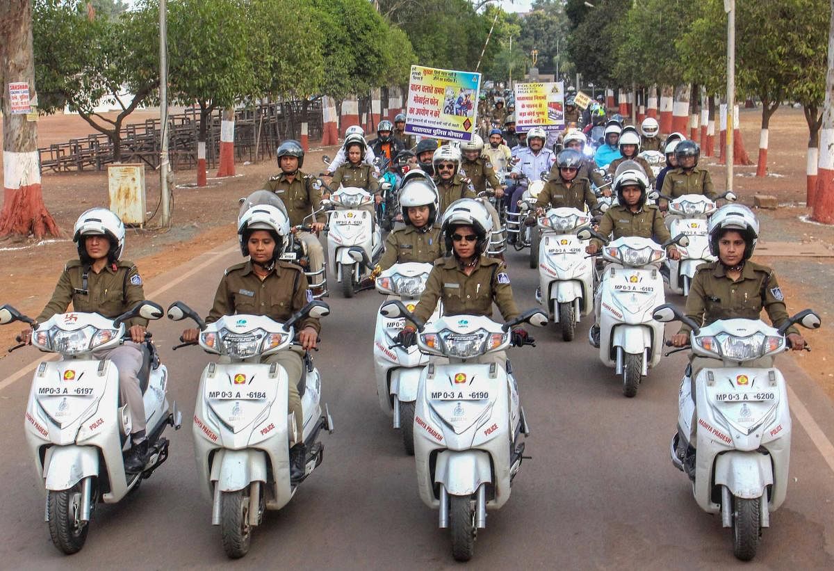 Madhya Pradesh Police contingent participate in a traffic awareness rally at the inauguration of 30th Road Safety Week, in Bhopal, Monday, Feb 4, 2019. (PTI Photo)