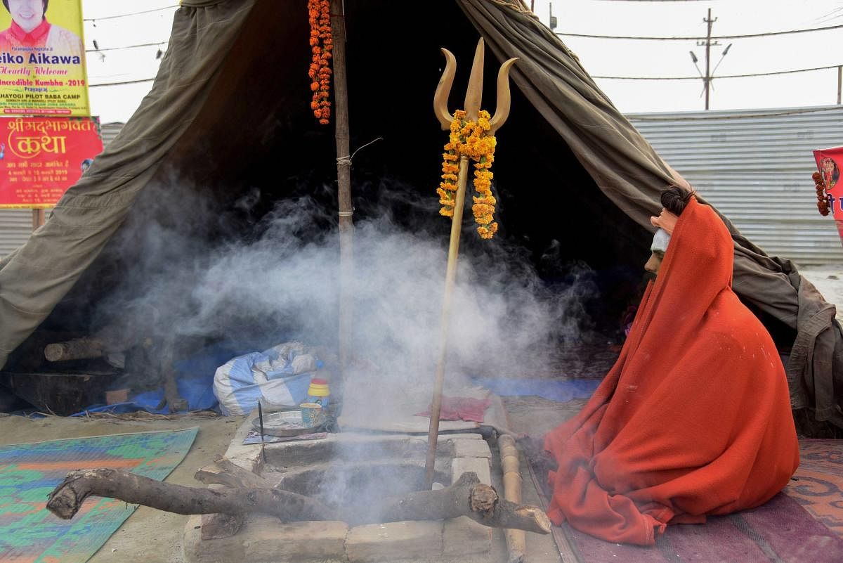 Allahabad: A sadhu offer prayers at outside his tent during the ongoing Kumbh Mela, in Allahabad (Prayagraj), Tuesday, Feb. 05, 2019. (PTI Photo)