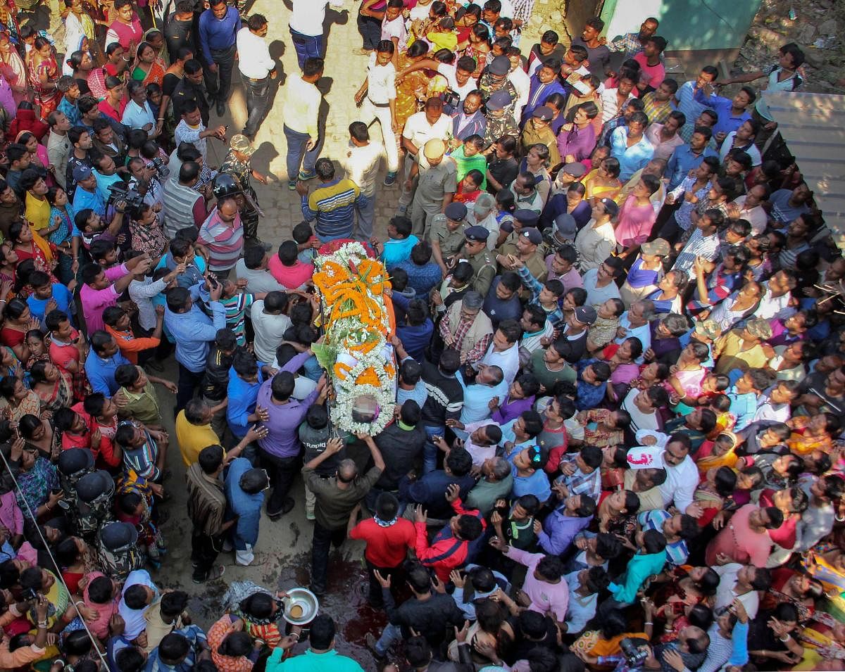 People attend the funeral of Trinamool Congress MLA Satyajit Biswas, in Nadia district of West Bengal, Sunday, Feb. 10, 2019. Satyajit was shot dead Saturday when he was attending a programme to inaugurate a Saraswati puja. (PTI Photo)