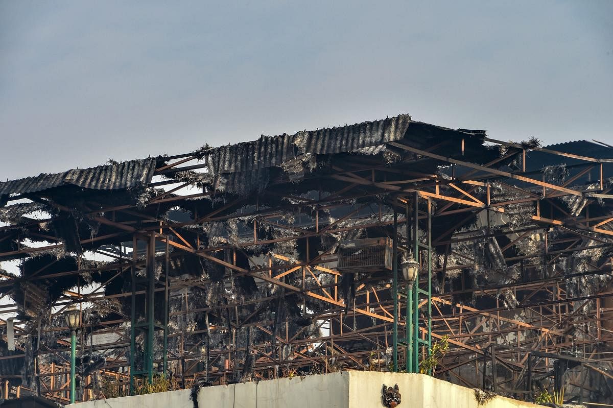 A view of charred remains on the rooftop of Karol Bagh's Hotel Arpit Palace where a massive fire broke out, in New Delhi, Tuesday, Feb. 12, 2019. At least 17 people were killed and several others were injured in the accident. (PTI Photo/ Shahbaz Khan)