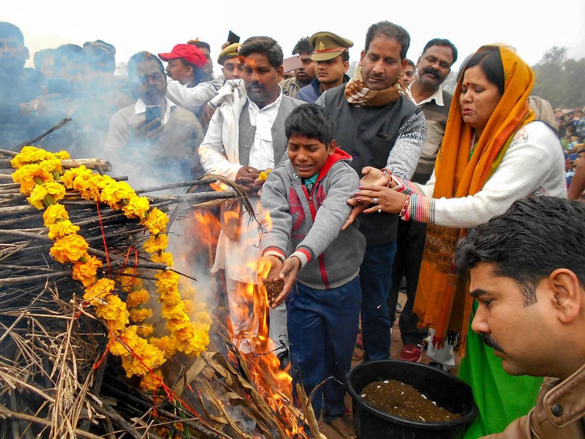 Kin of slain CRPF jawan Ram Vakeel perform last rites during his cremation, in Mainpuri, Saturday, Feb. 16, 2019. Vakeel lost his life in Thursday's Pulwama terror attack (PTI Photo)