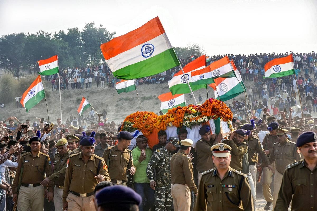 A large number of people attend the funeral procession of CRPF jawan Ramesh Yadav, who lost his life in Thursday's Pulwama terror attack, at Masaurhi, in Varanasi, Saturday, Feb. 16, 2019. (PTI Photo)