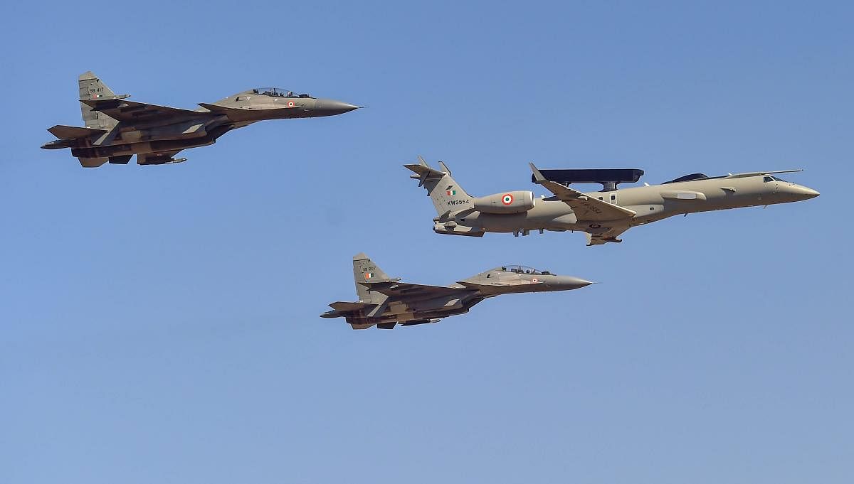 IAF's Indigenous Airborne Early Warning and Control System (AEW&C) flies with SU-30 aircrafts in a formation during a rehearsal for the 12th edition of AERO India 2019 at Yelahanka airbase in Bengaluru, Monday, Feb 18, 2019. (PTI Photo)