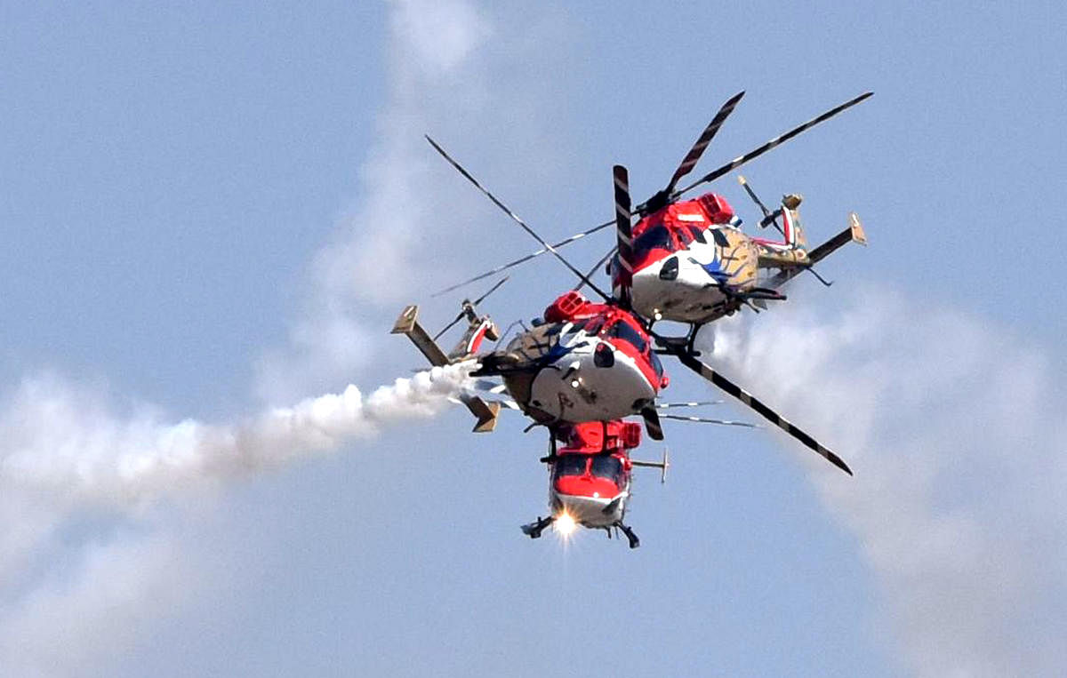Sarang Helicopters performing at the inaugural day of Aero India organised by Defence Ministry at Yalahanka Aero Space in Bengaluru on Wednesday. (DH Photo by S K Dinesh)