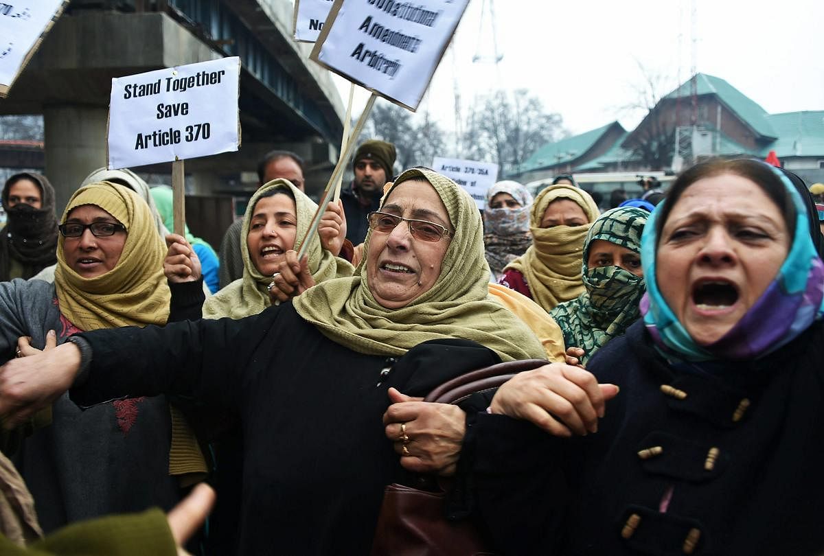 National Conference (NC) workers raise slogans during a protest against arbitrary use of 'legislative authority' by the Jammu and Kashmir Governor, in Srinagar. PTI