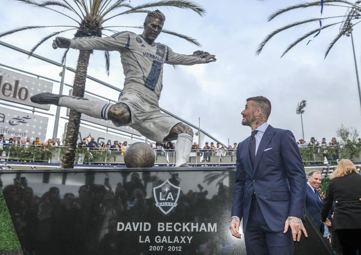 Former LA Galaxy MLS soccer midfielder David Beckham looks at a statue of himself at Legends Plaza in front of Dignity Health Sports Park in Carson, California. AP/PTI