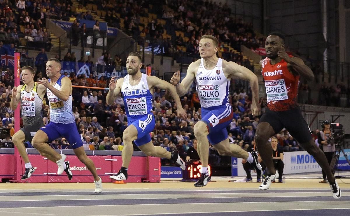 Gold medalist Jan Volko of Slovakia, 2nd right, and bronze medalist Emre Zafer of Turkey, right, race to the finish line in the men's 60 meters race final at the European Athletics Indoor Championships at the Emirates Arena in Glasgow, Scotland. AP/PTI