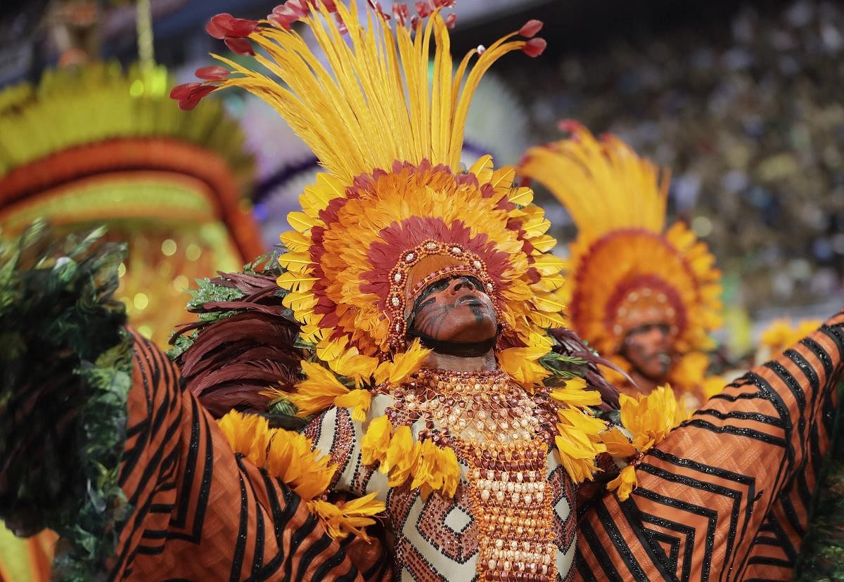 A dancer from the Mocidade Alegre samba school performs during a carnival parade in Sao Paulo, Brazil. AP/PTI