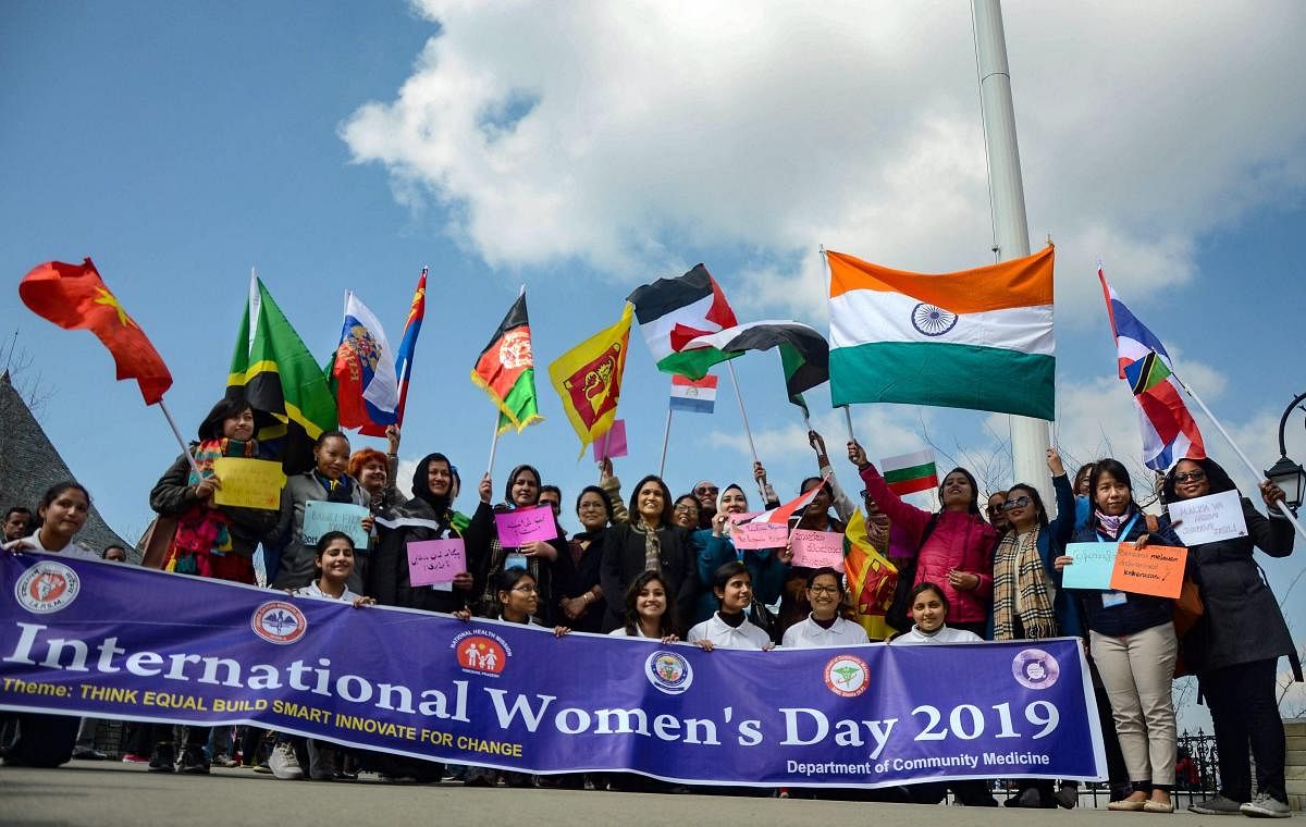 Participants from different countries take part in an event on the eve of International Woman’s Day, during the International Public Health Management Development Program organized by PGIMER Chandigarh at Ridge in Shimla. PTI