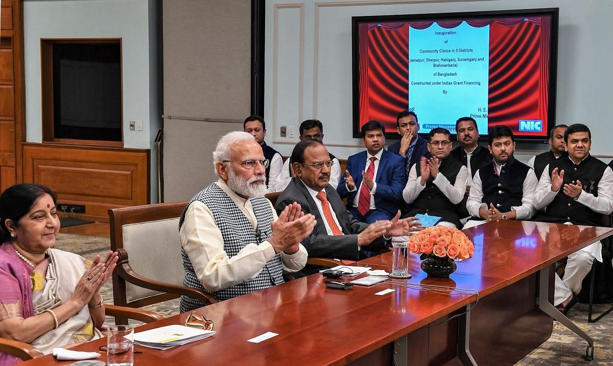 Prime Minister Narendra Modi and his Bangladesh counterpart Sheikh Hasina (unseen) jointly inaugurate development projects in Bangladesh through video conferencing, in New Delhi, Monday, March 11, 2019. External Affairs Minister Sushma Swaraj and National Security Advisor Ajit Doval are also seen. (MEA/PTI Photo)