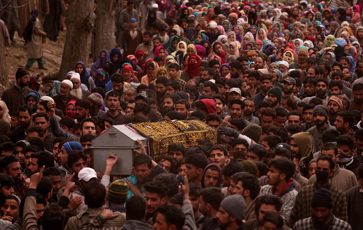 People carry the coffin containing the body of Mudasir Khan, a suspected militant, who according to local media was killed during a gun battle with Indian security forces on Sunday, during his funeral in Midoora village in south Kashmir's Pulwama district March 11, 2019. REUTERS/Danish Ismail