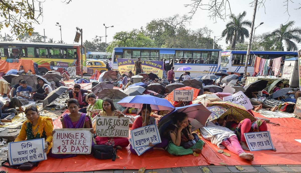West Bengal School Service Commission (SSC) candidates sit on an indefinite hunger strike to press for their demands, in Kolkata, Tuesday, March 12, 2019. (PTI Photo/Ashok Bhaumik)