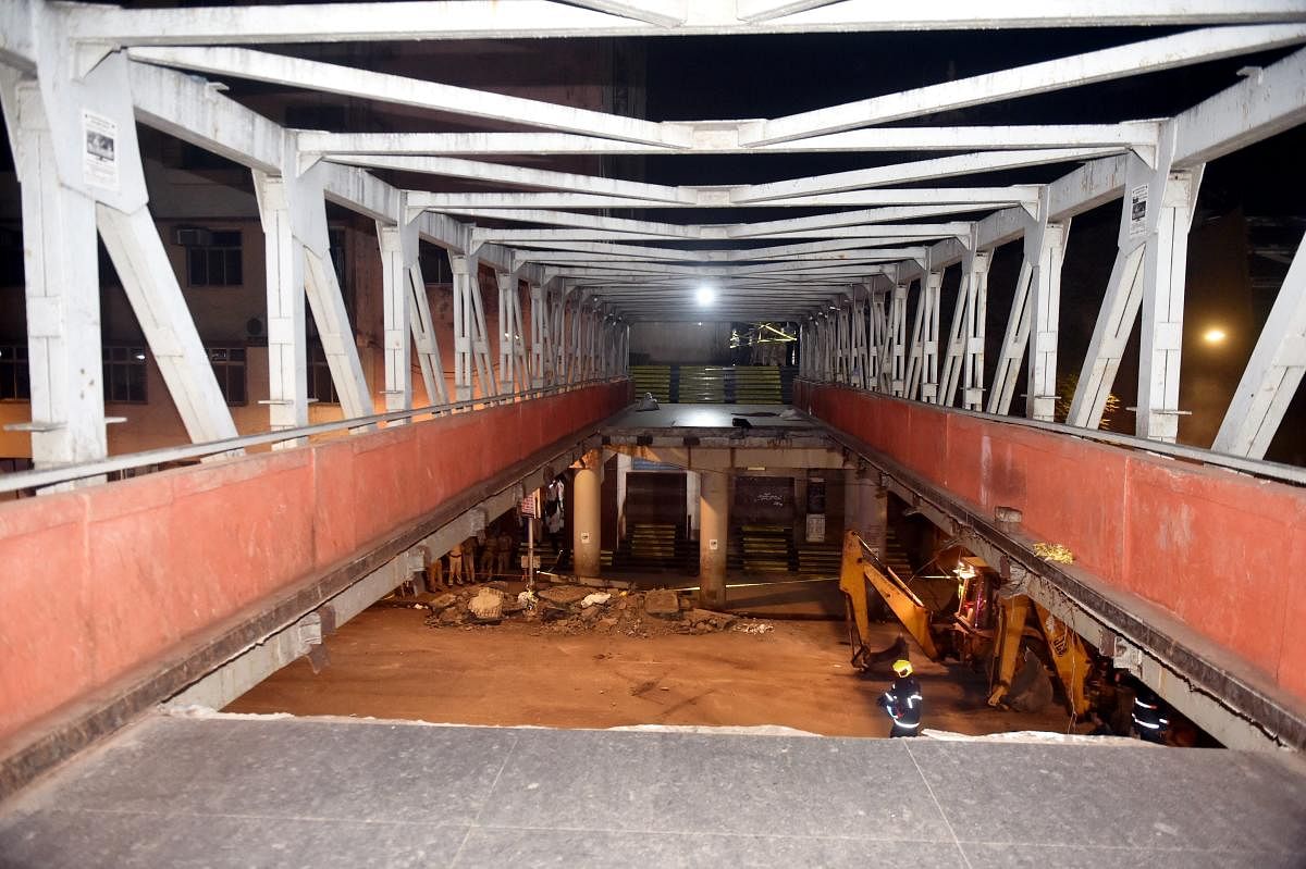 A view of the partially collapsed foot overbridge in south Mumbai. The bridge connected the bustling Chhatrapati Shivaji Maharaj Terminus railway station with the Azad Maidan Police Station. (PTI Photo)