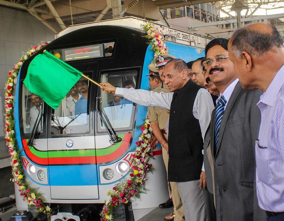 Telangana and Andhra Pradesh Governor ESL Narasimhan flags off a metro train service from Ameerpet Metro station, in Hyderabad. (PTI Photo)