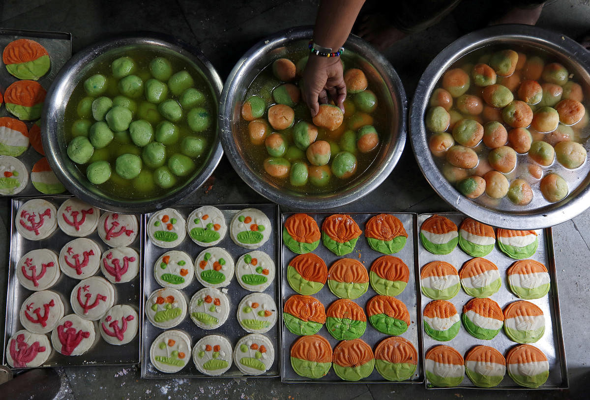 Sweets featuring election symbol of different political parties are pictured inside a sweets making workshop on the outskirts of Kolkata. (Reuters Photo)