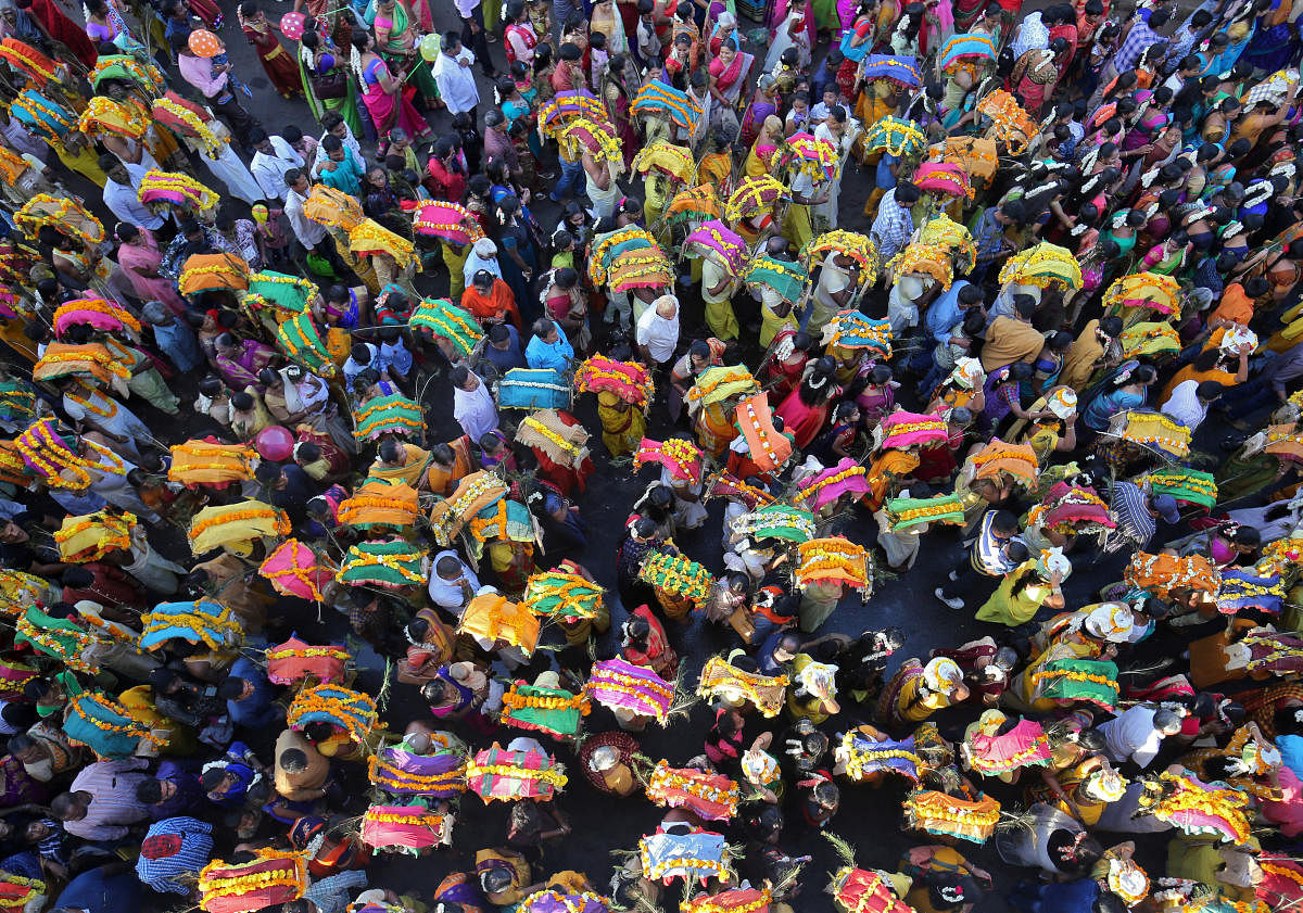 Devotees take part in a procession during the religious festival of Panguni Uthiram in Ahmedabad. (Reuters Photo)