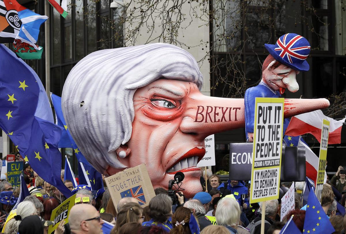 A doll resembling British Prime Minister Theresa May stands among demonstrators during a Peoples Vote anti-Brexit march in London, Saturday, March 23, 2019. The march, organized by the People's Vote campaign is calling for a final vote on any proposed Brexit deal. This week the EU has granted Britain's Prime Minister Theresa May a delay to the Brexit process. AP/PTI