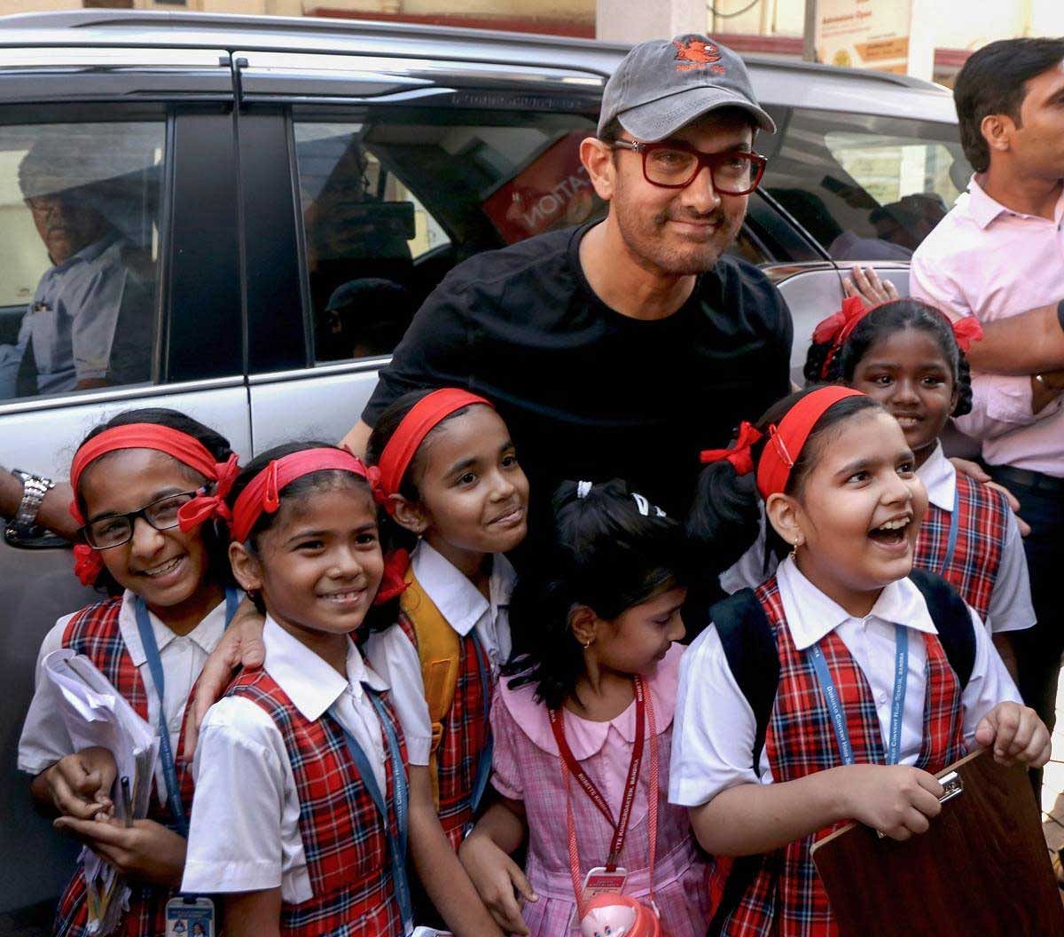 Bollywood actor Aamir Khan poses with children, in Mumbai, Wednesday, March 27, 2019. (PTI Photo)
