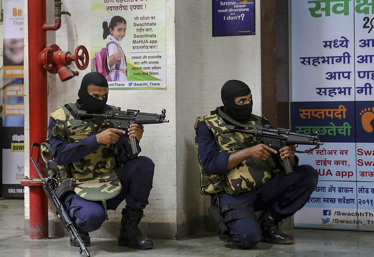 Security personnel stage a mock drill to prepare Thane Municipal Corporation against a terror attack, in Thane, Thursday, March 28, 2019. (PTI Photo)