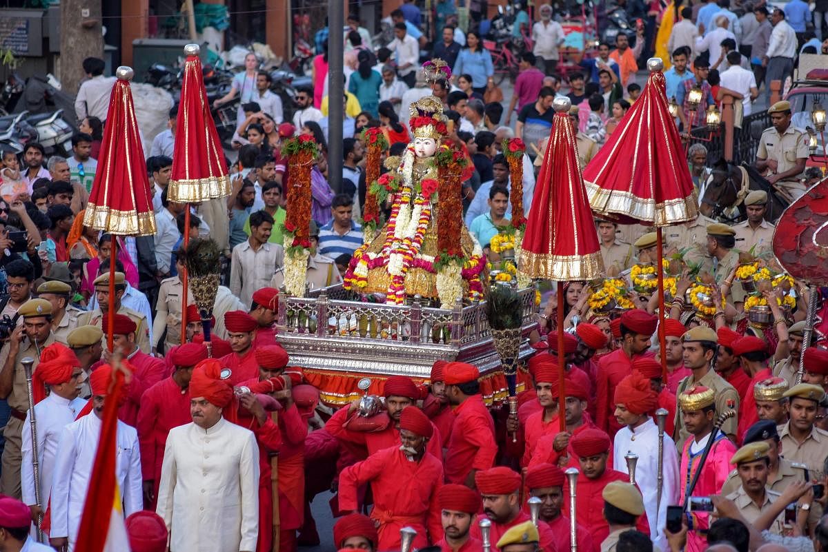 People take part in a traditional Gangour procession at Tripolia Gate, in Jaipur, Monday, April 08, 2019. (PTI Photo)