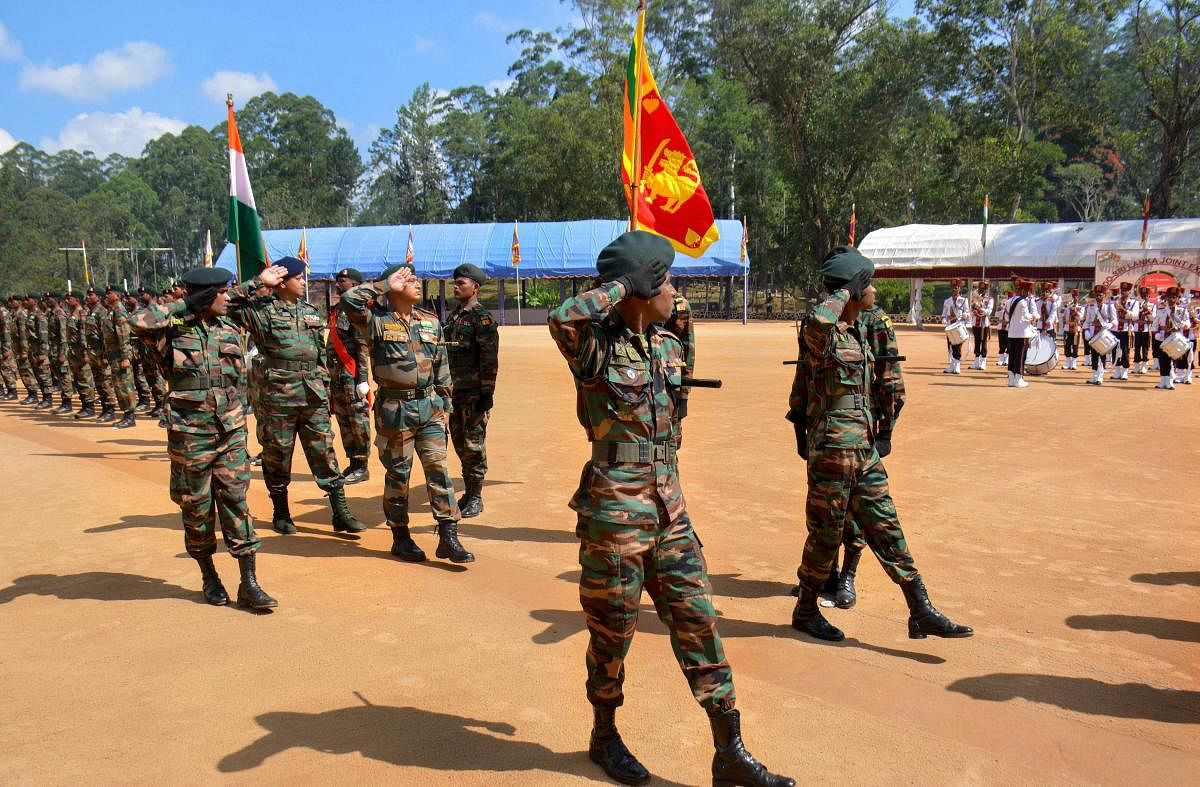 Marching contingents of Indian and Sri Lankan armies during the conclusion ceremony of India-Sri Lank joint exercise 'Mitra Shakti', in Diyatalawa, Sri Lanka, Monday, April 8, 2019. (PTI Photo)