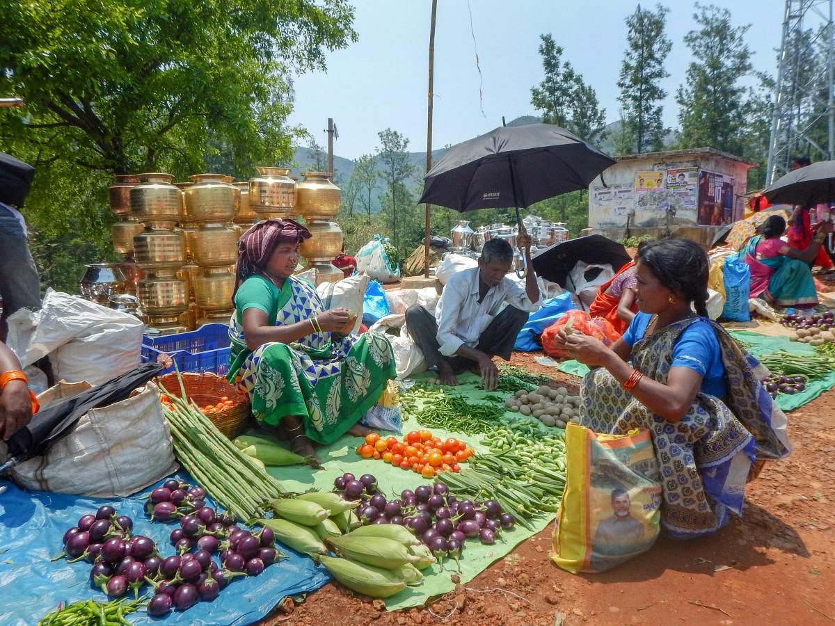 Borra tribals sell vegetables and other produce at a local haat in Araku valley of Vishakapatnam district, Sunday, April 07, 2019. (PTI Photo)