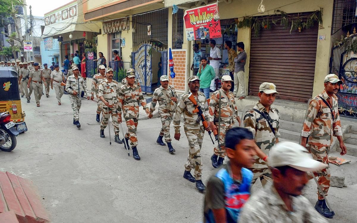 Security forces personnel march in a street on the eve of the 1st phase of 2019 Lok Sabha elections, at Uppaguda in Hyderabad, Wednesday, April 10, 2019. (PTI Photo)