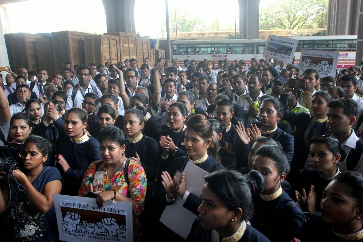 Mumbai: Jet Airways employees during a protest for not receiving their salaries at their office, in Mumbai, Friday, April 12, 2019. PTI