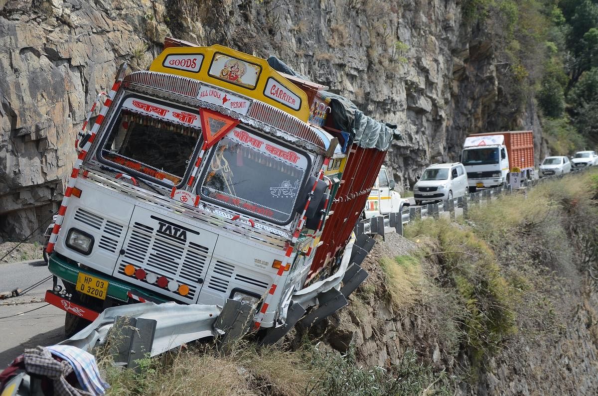 Shimla: A truck skids off the road in Shimla, Saturday, April 13, 2019. PTI