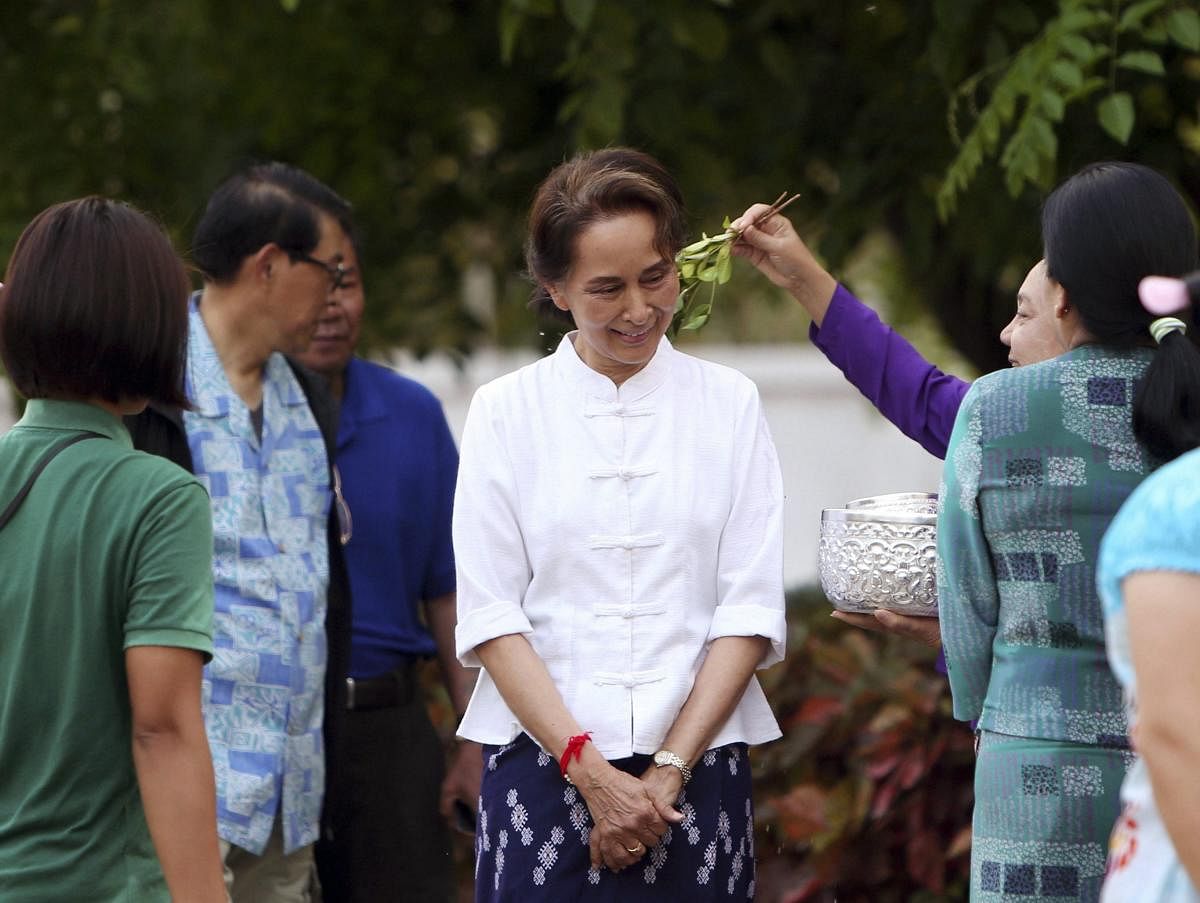 Naypyitaw: Myanmar's leader Aung San Suu Kyi, center, is sprinkled with scented water by first lady Cho Cho as they take part in the first day of Myanmar traditional water festival, also known as Myanmar New Year, in Naypyitaw, Myanmar Saturday, April 13, 2019. AP/PTI