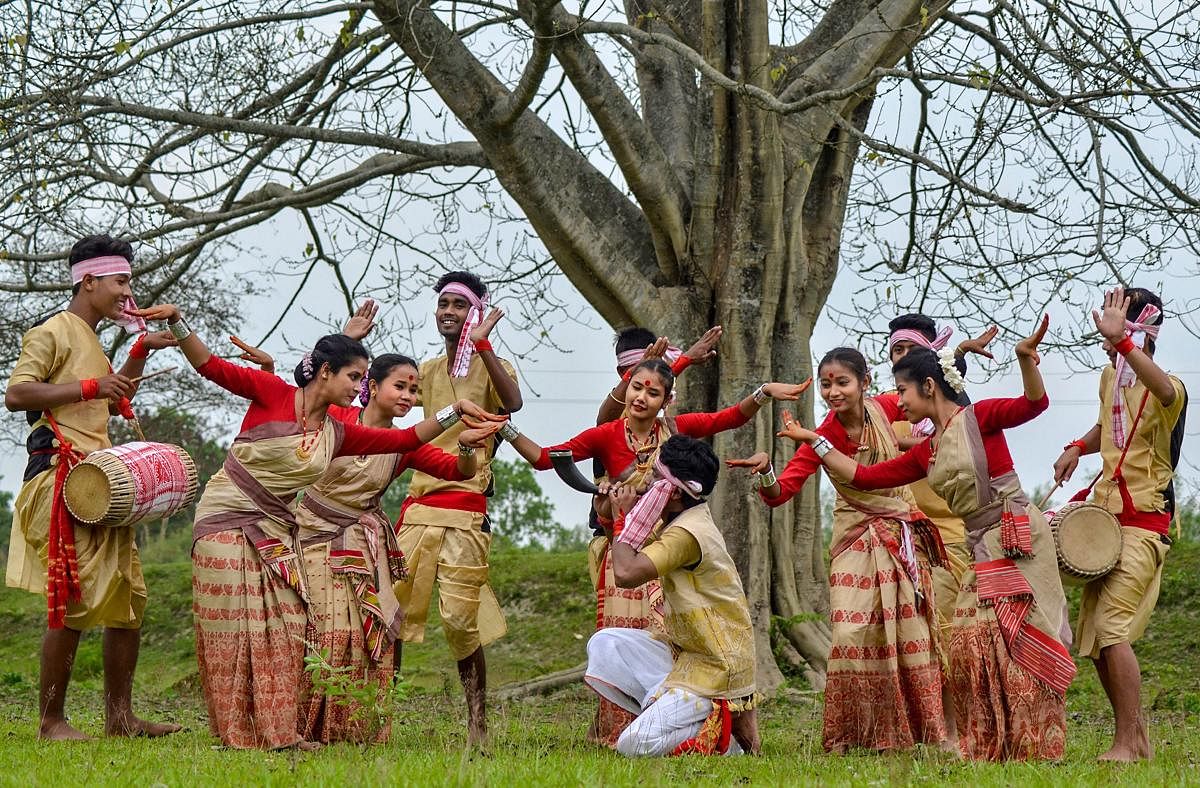 Dibrugarh: People celebrate Rongali Bihu by performing a traditional Bihu dance, in Dibrugarh, Sunday, April 14, 2019. PTI