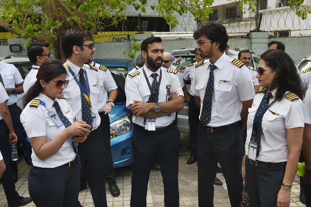 Jet Airways pilots and engineers assemble outside the Jet headquarters to express solidarity with the management and to request lenders to release the funds, in Mumbai, Monday April 15, 2019.The airline is operating just 6-7 planes, with almost its entire fleet being grounded due to non-payment of rentals to lessors amid severe paucity of cash. PTI