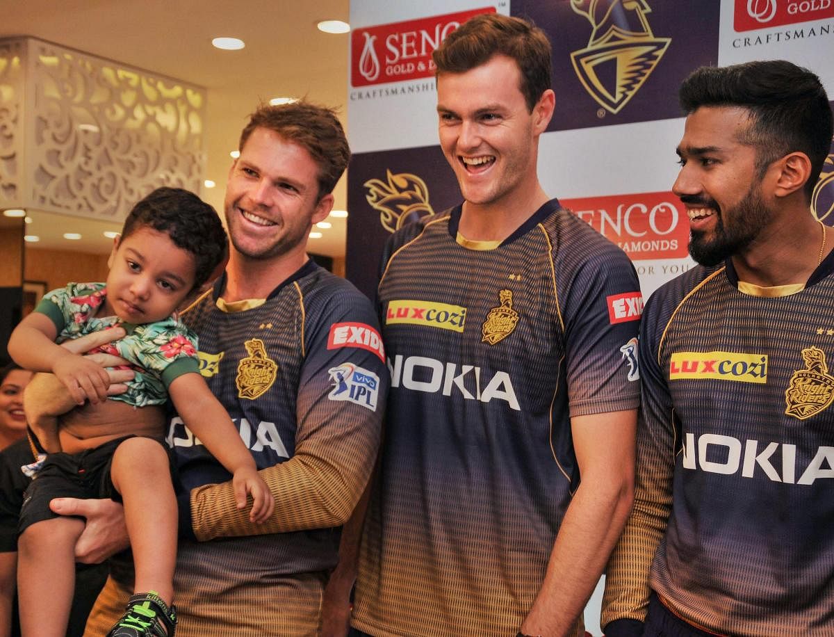 Kolkata Knight Rider (KKR) cricketers Lockie Ferguson (L), Matthew Kelly (C) and Sandeep Warrier pose for a photograph during a promotional event, at Salt Lake City in Kolkata, Wednesday, April 17, 2019. PTI