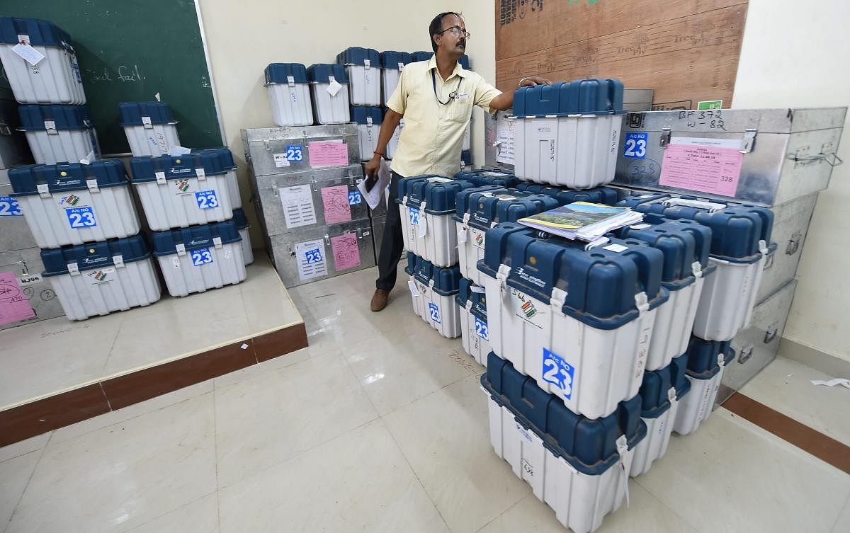 A polling offical counts boxes containing Electronic Voting Machines (EVM) and Voter Verified Paper Audit Trail machines (VVPATs) at a distribution centre, ahead of the second phase of the 2019 Lok Sabha elections, at Nandhanam Arts College in Chennai, Wednesday, April 17, 2019. PTI
