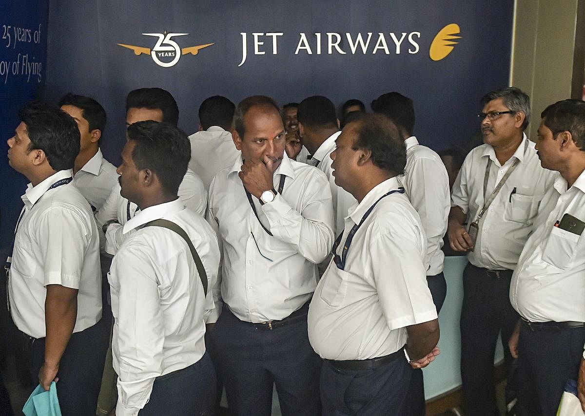 Mumbai: Jet Airways employees gather outside the company's corporate office as the airlines announces temporary suspension of flight operations, in Mumbai, Thursday, April 18, 2019. PTI