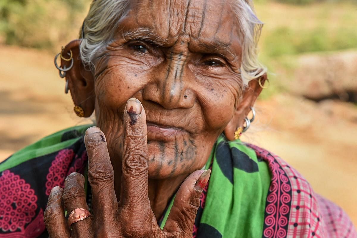 Kandhamaal: An elderly voter show her finger marked with indelible ink at Adabadi polling booth during the second phase of Lok Sabha elections, in Kandhamaal, Thursday, April 18, 2019. PTI