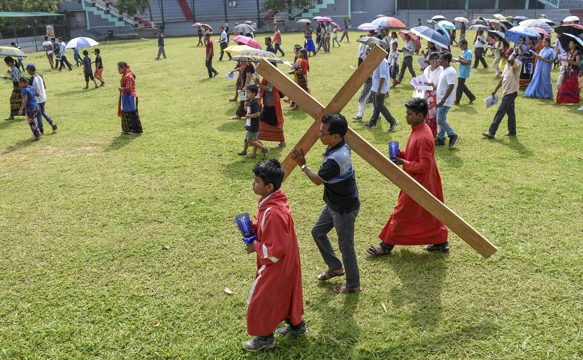 Christian devotees arrive to attend a mass prayer to observe Good Friday, in Agatala, Friday, April 19, 2019. (PTI Photo)