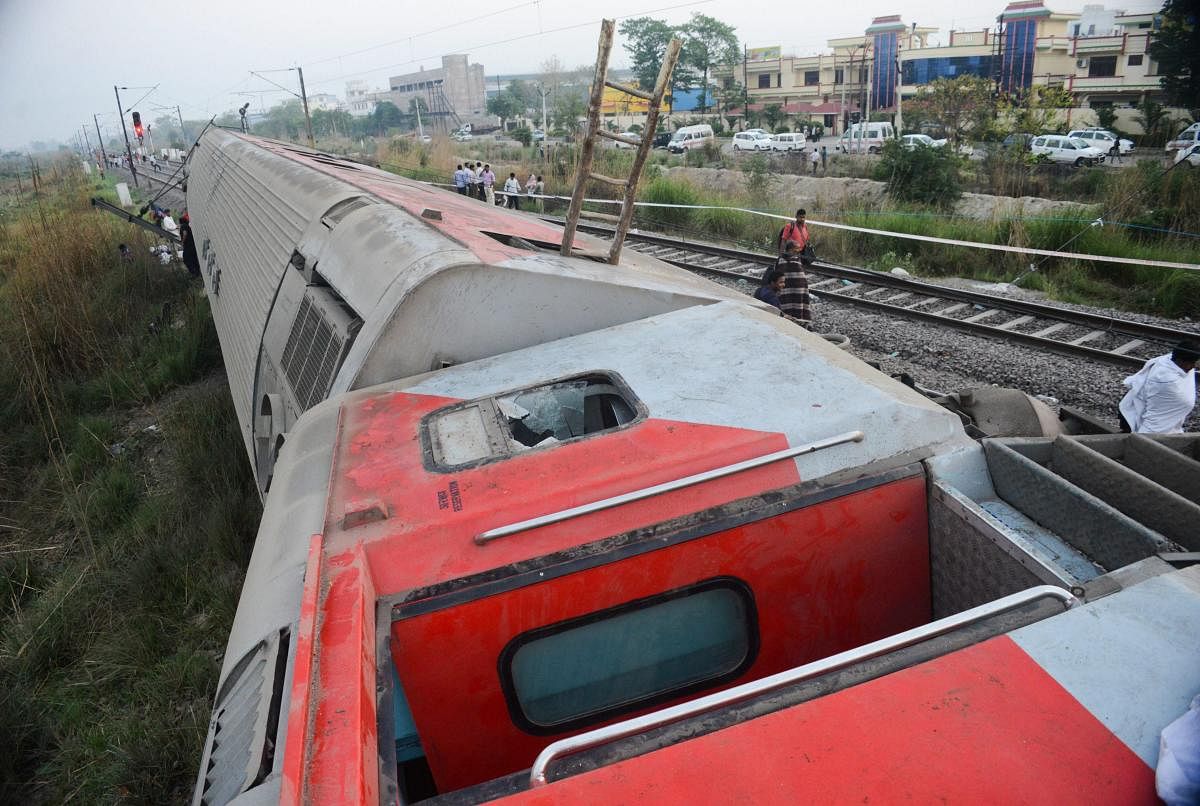 The derailed Howrah-New Delhi Poorva Express, near Kanpur, early Saturday, April 20, 2019. Twelve coaches of the traim derailed near Kanpur injuring at least 13 people, railway officials said. (PTI Photo)