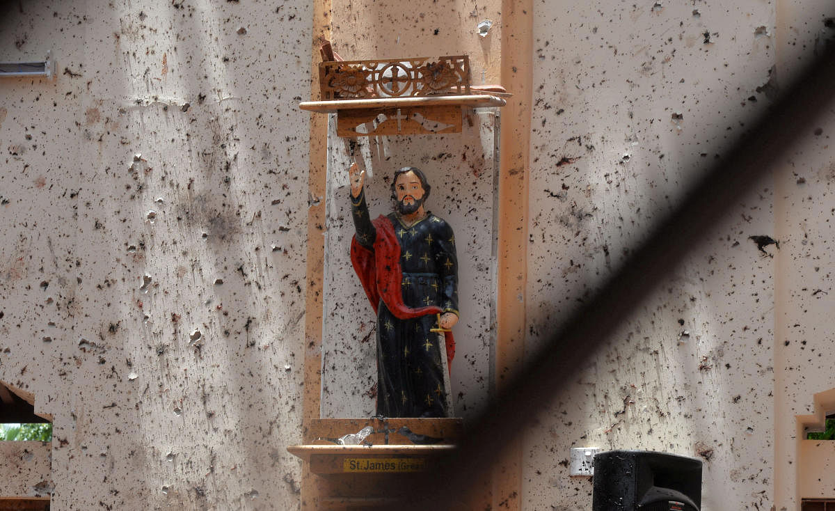 A statue of St. James is pictured after a bomb blast inside a church in Negombo, Sri Lanka April 21, 2019. REUTERS/Stringer