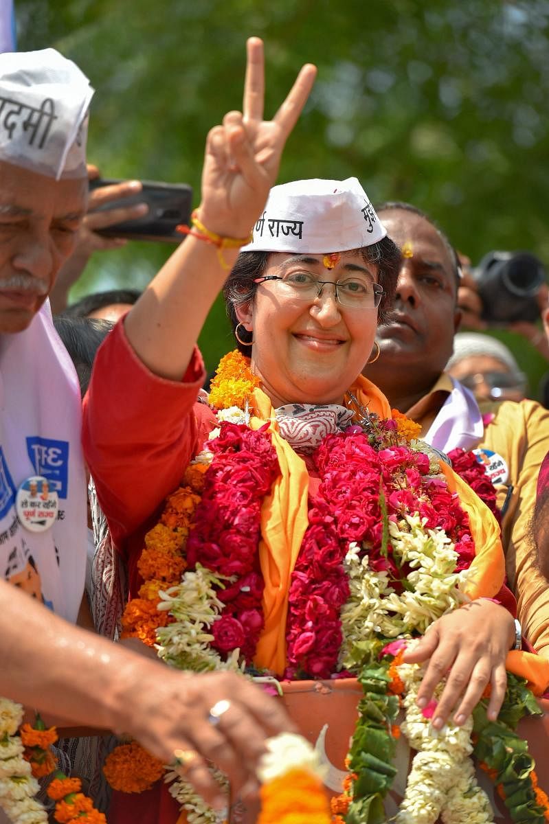 Aam Aadmi Party's (AAP) candidate from East Delhi, Atishi, shows victory sign on her way to file nomination papers for the Lok Sabha elections, in New Delhi, Monday, April 22, 2019. (PTI Photo/ Kamal Kishore)