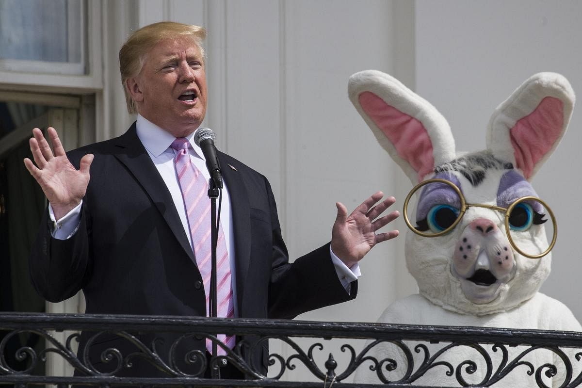 US President Donald Trump and the Easter Bunny wave during the annual White House Easter Egg Roll on the South Lawn of the White House in Washington, DC on April 22, 2019.