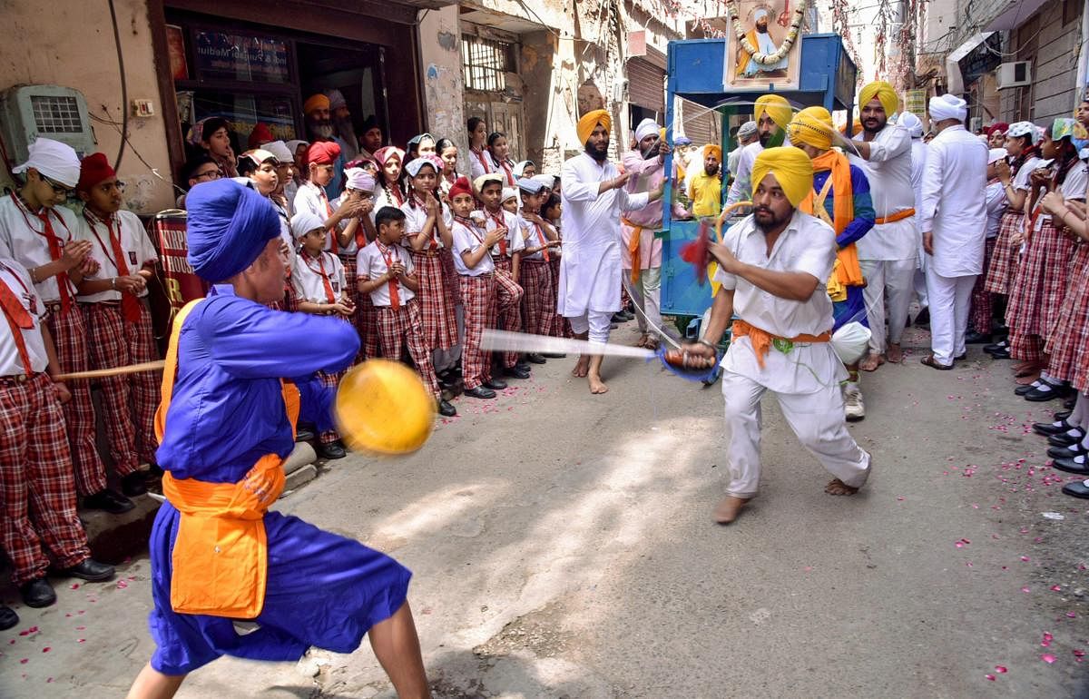 Amritsar: Sikh devotees participate in a 'Nagar Kirtan' procession to mark the birth anniversary of Guru Tegh Bahadur, the ninth of the ten gurus of Sikhism, in Amritsar, Tuesday, April 23, 2019. (PTI Photo)