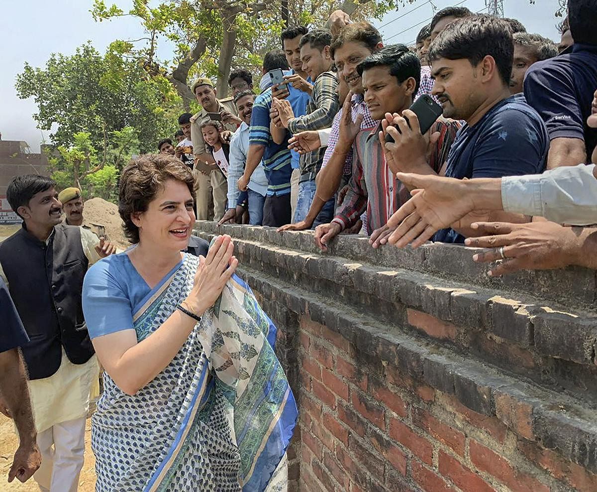 Congress General Secretary Priyanka Gandhi Vadra meets her supporters during an election campaign for Lok Sabha elections, Fatehpur district of UP, Wednesday, April 24, 2019. (PTI Photo)
