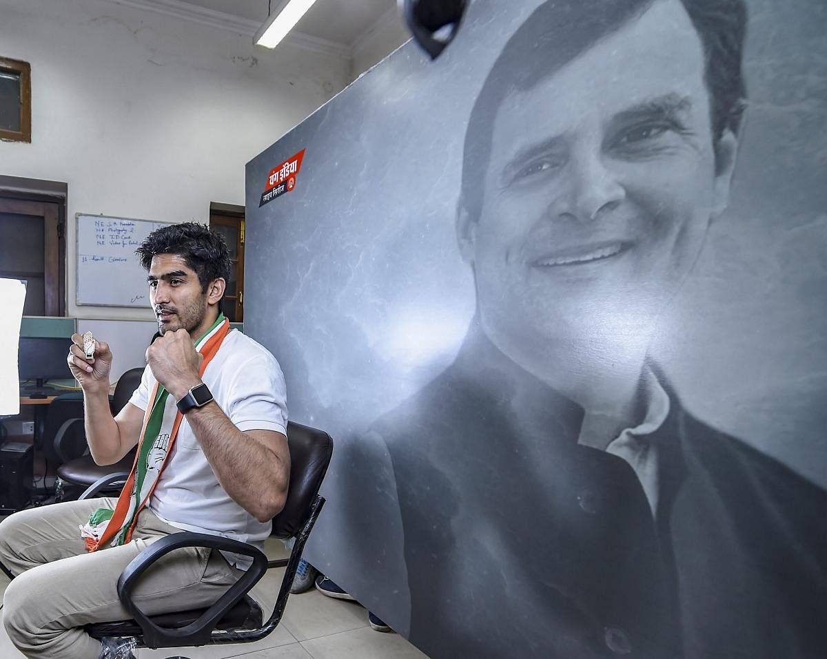 Boxer and Congress candidate from South Delhi constituency Vijender Singh poses for photograph at Youth Congress office, ahead of the Lok Sabha polls in New Delhi, Wednesday, April 24, 2019. (PTI Photo/Atul Yadav)