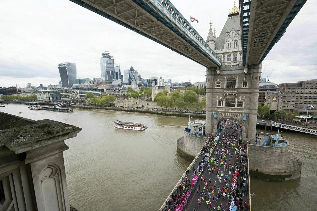 Runners take part in the 2019 London Marathon, over Tower Bridge in London. (AP/PTI Photo)