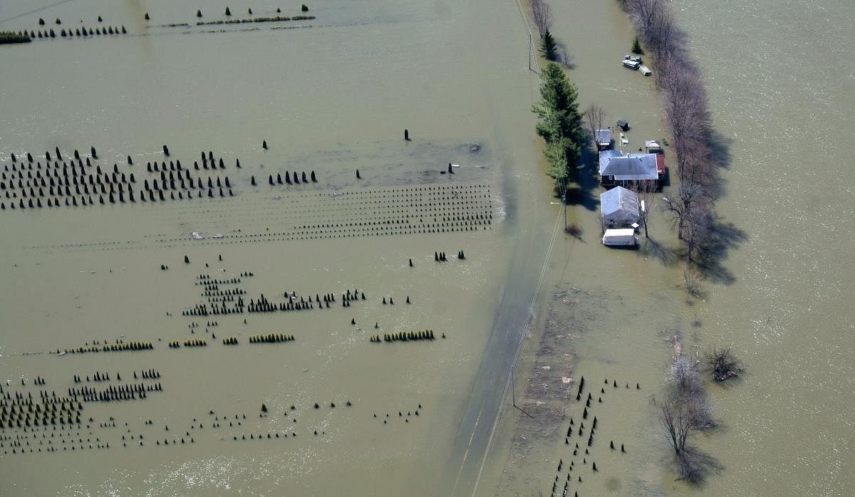 A house is isolated by flood waters in Rigaud, Quebec, Canada. Thousands of people have been forced from their homes in Quebec, Ontario and New Brunswick. (AP/PTI Photo)