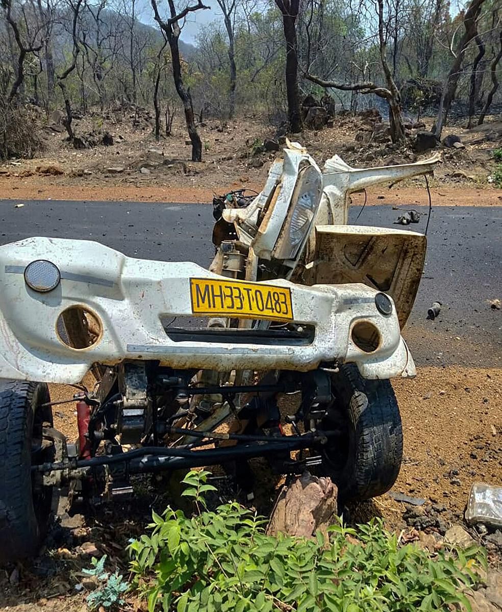 Mangled remains of a police vehicle that was blown up, allegedly by the Maoist rebels by using IED, while it was carrying 16 security personnel, in Gadchiroli district of Majharashtra. (PTI Photo)