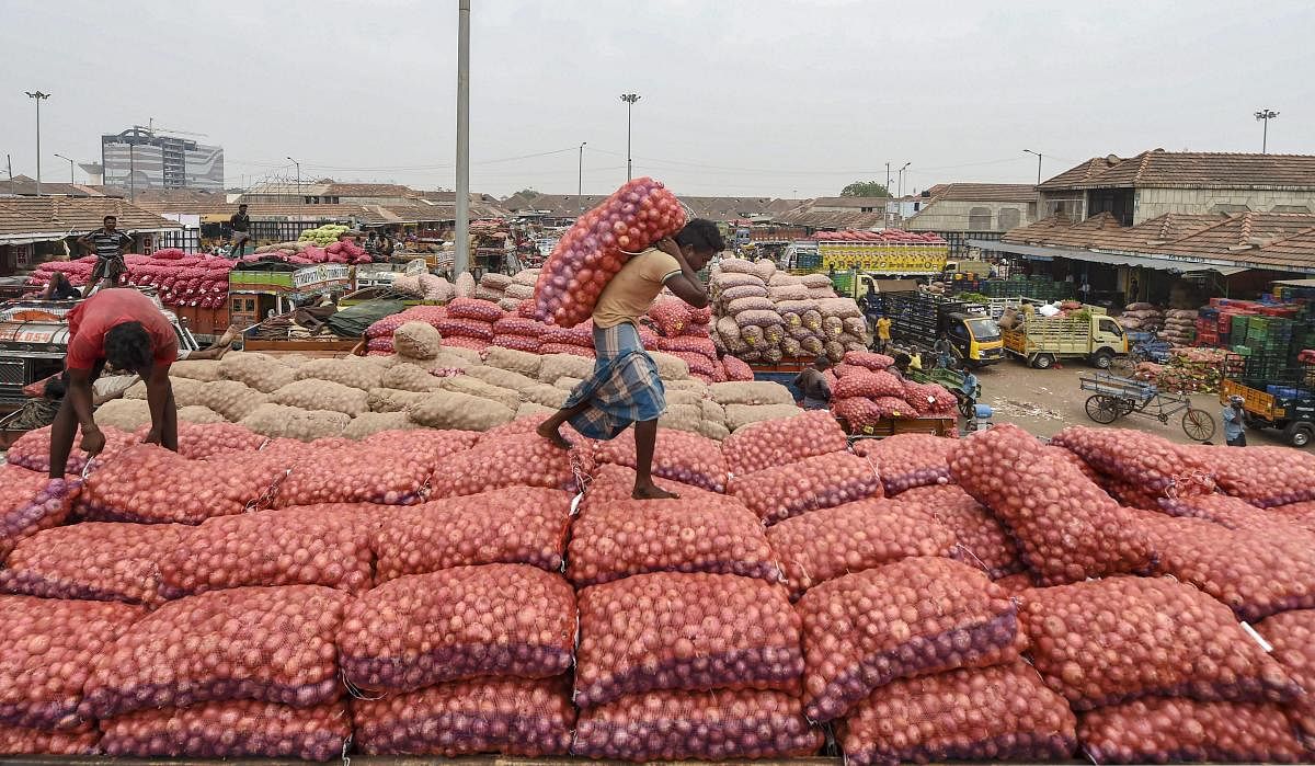 A labourer works at a vegetable market on Labour Day, in Chennai. (PTI Photo)