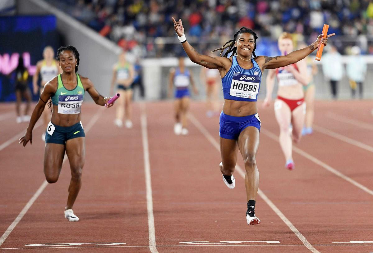 Aleia Hobbs of the U.S., right, crosses the finish line, winning the 4x100 meters women's relay final at the IAAF World Relays Sunday, May 12, 2019, in Yokohama, Japan. At left is Vitoria Cristina Rosa of Brazil. AP/PTI